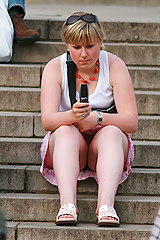 Blonde upskirts, while sitting on a stairway